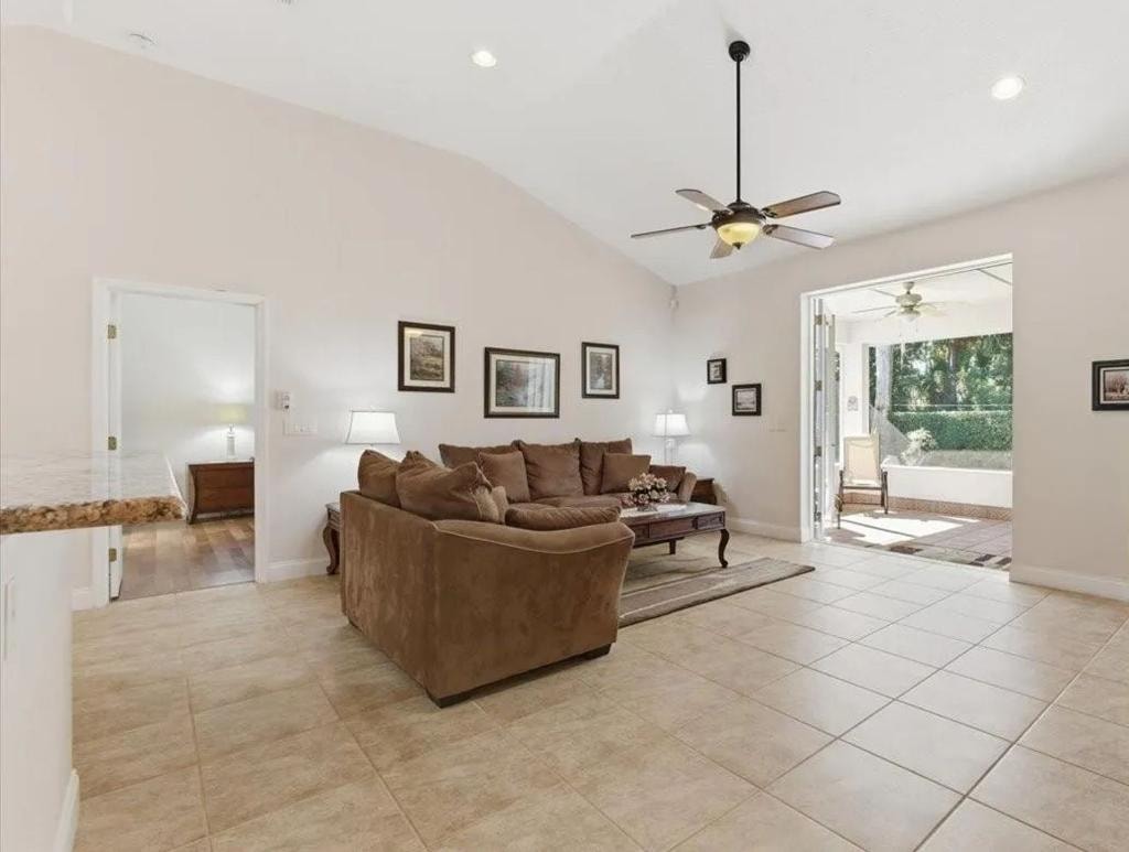 Open living room with vaulted ceilings and tile floors at The Heart of Palms